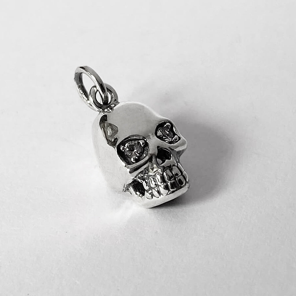 Sterling silver skull charm with crystal eyes