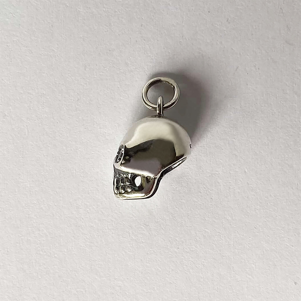 Sterling silver skull charm with crystal eyes