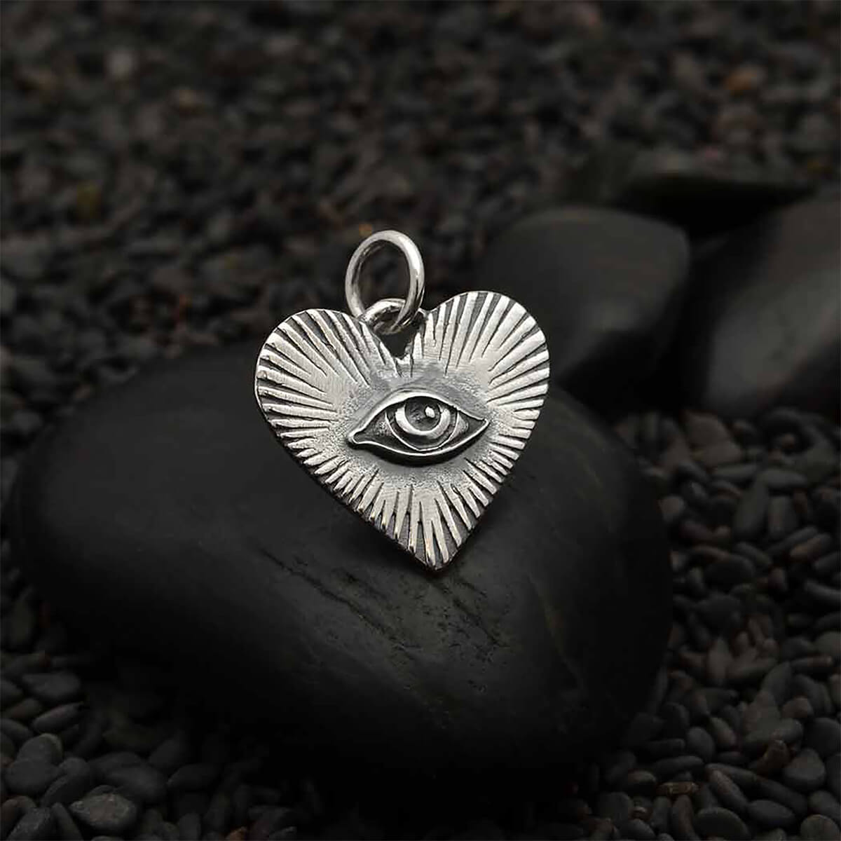 High quality heart charm with central eye and radial design sterling silver pendant