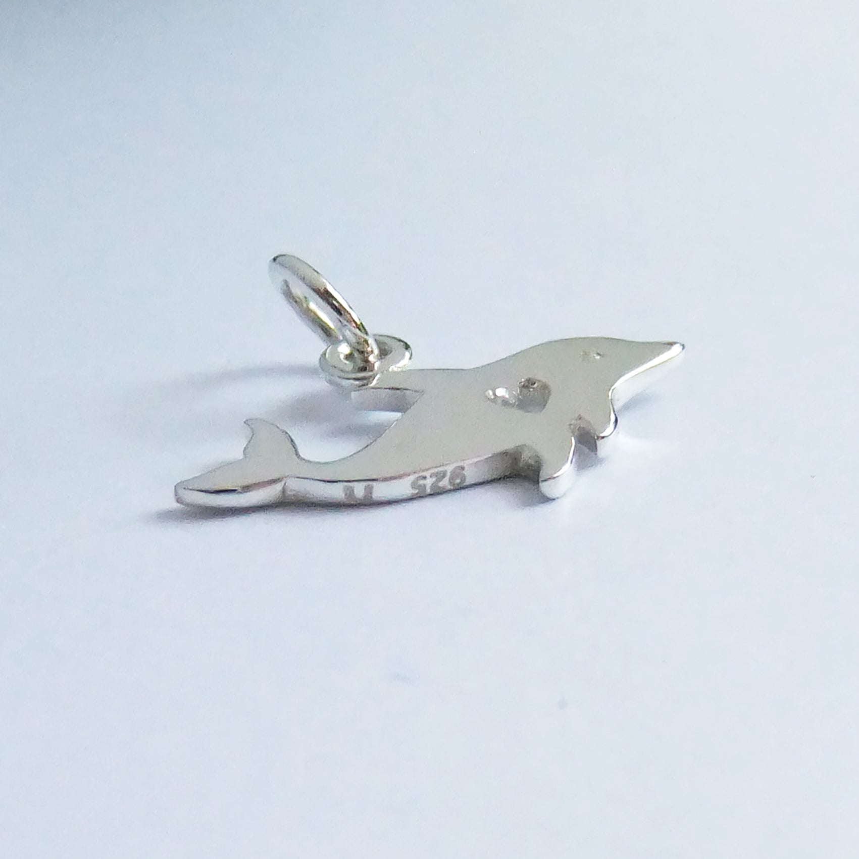 dolphin silhouette with heart charm