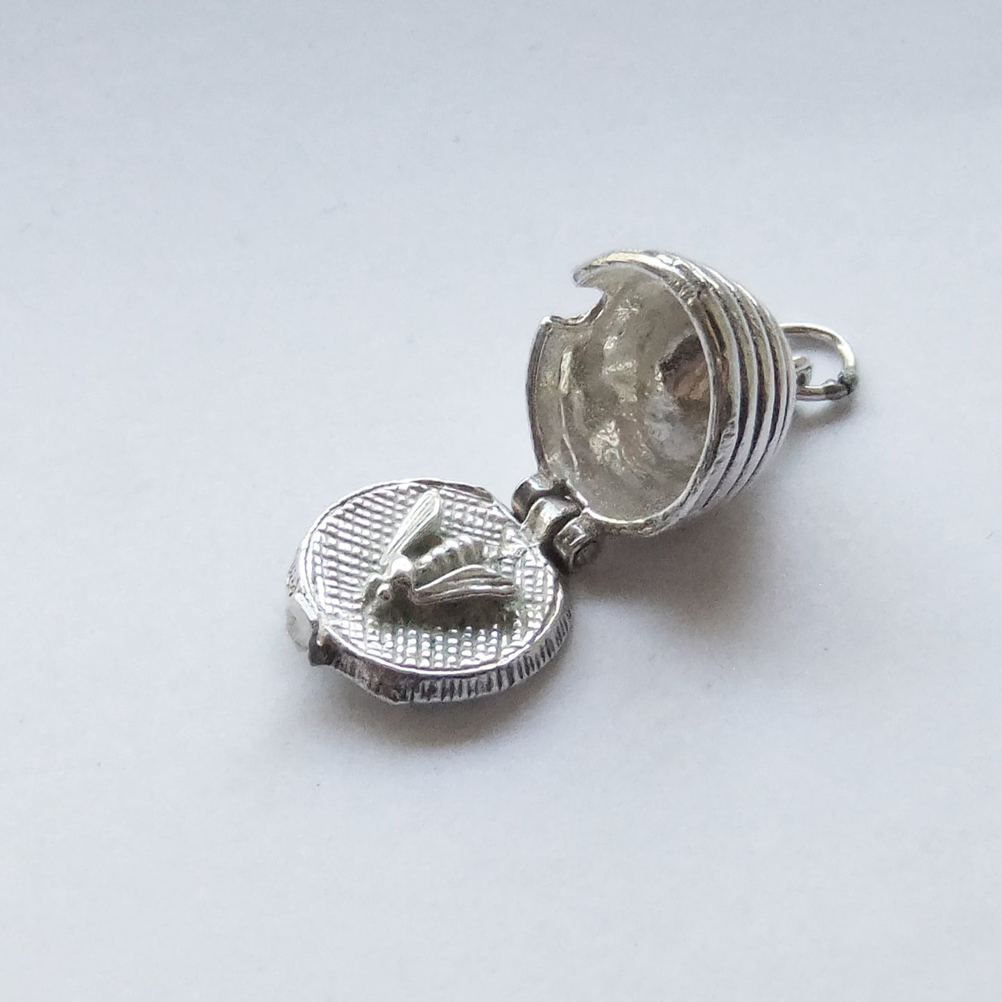 Vintage silver bee in beehive charm opens