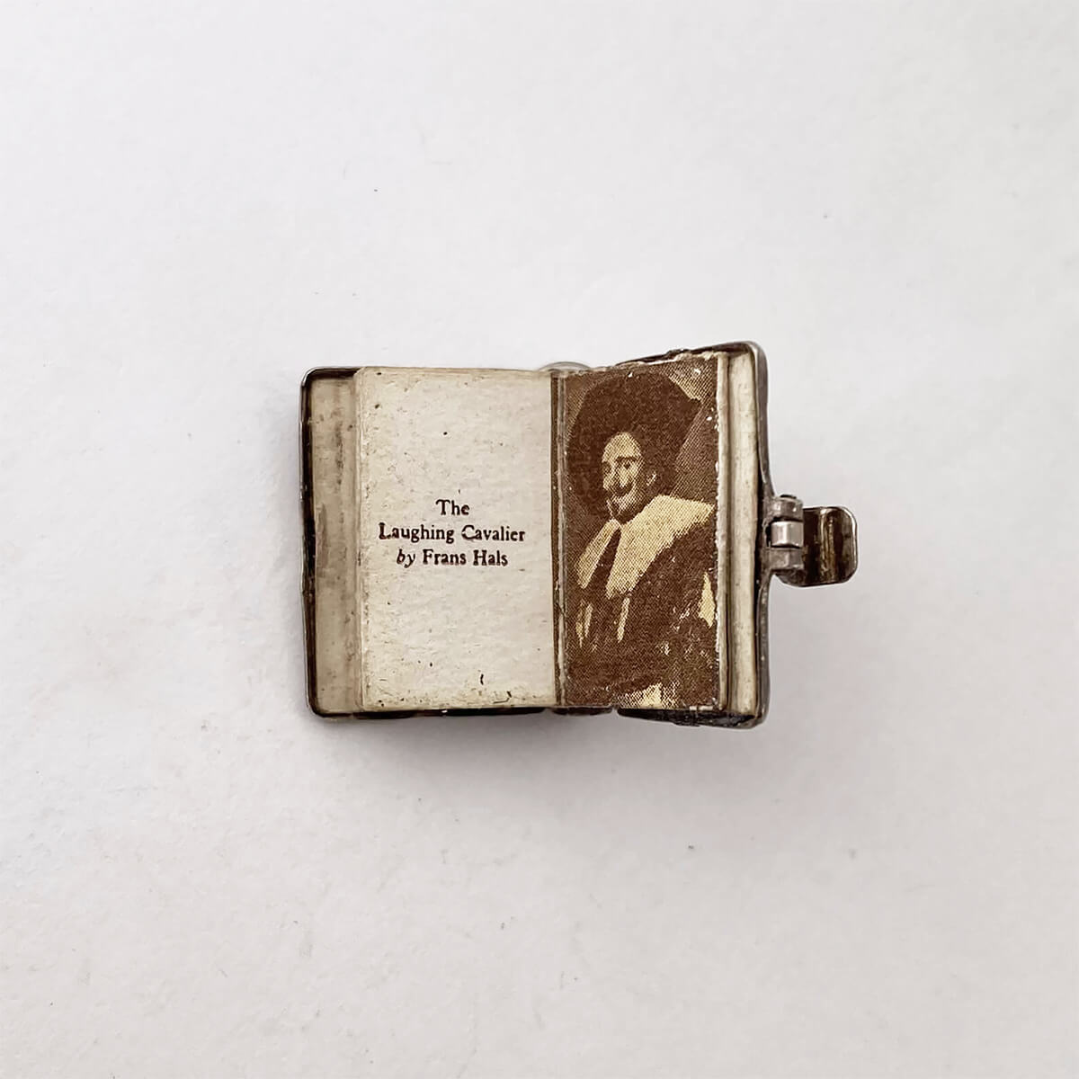 The Old Masters book charm vintage silver opens to pages of art masterpiece paintings opening pages mechanical pendant Charmarama