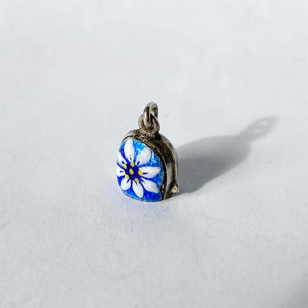 Vintage Alps bell charm with blue enamel and white edelweiss flower 800 silver from Charmarama Charms