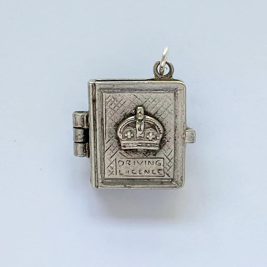 Mechanical driving licence charm with papers inside pendant