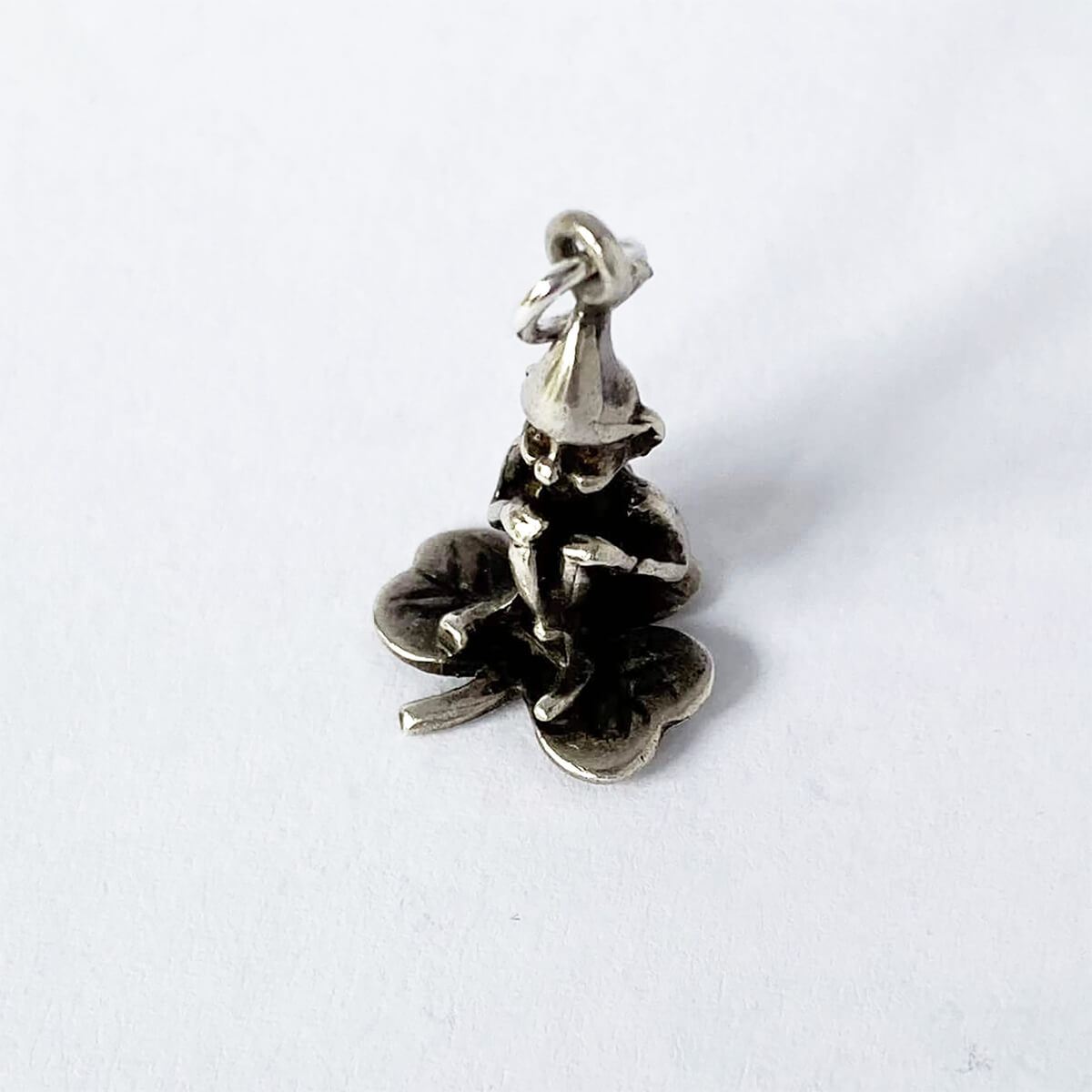 Vintage sterling silver gnome sitting on three leaf clover charm lucky Irish pendant