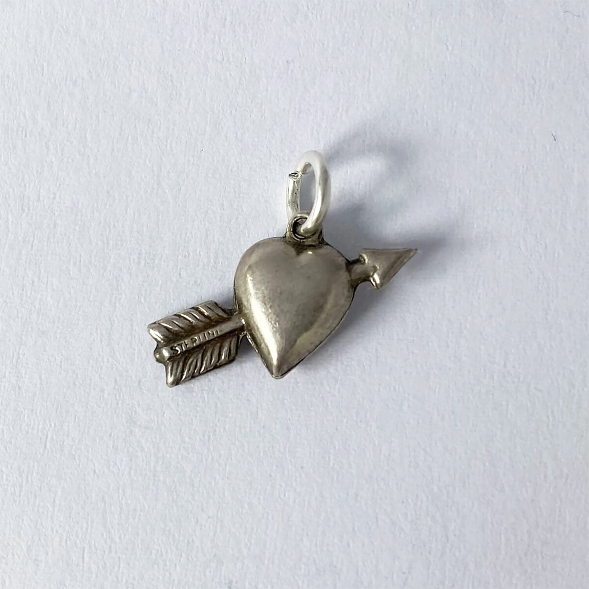 Vintage 1940s sterling silver loveheart and arrow charm from Charmarama