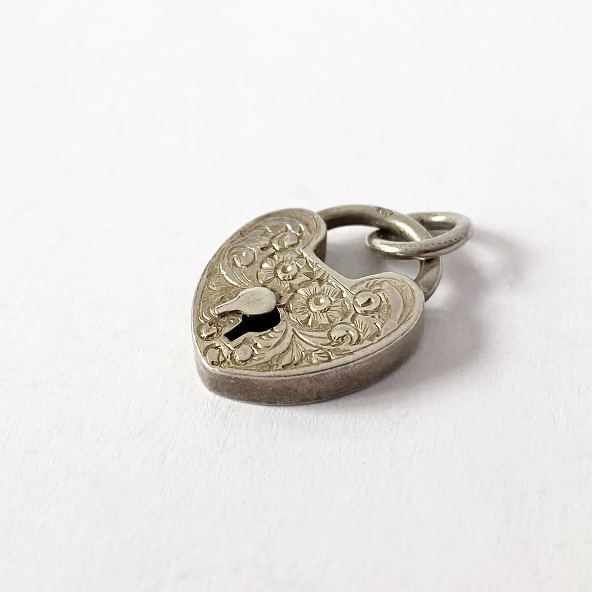 1900 Victorian sterling silver flowers heart shaped padlock charm