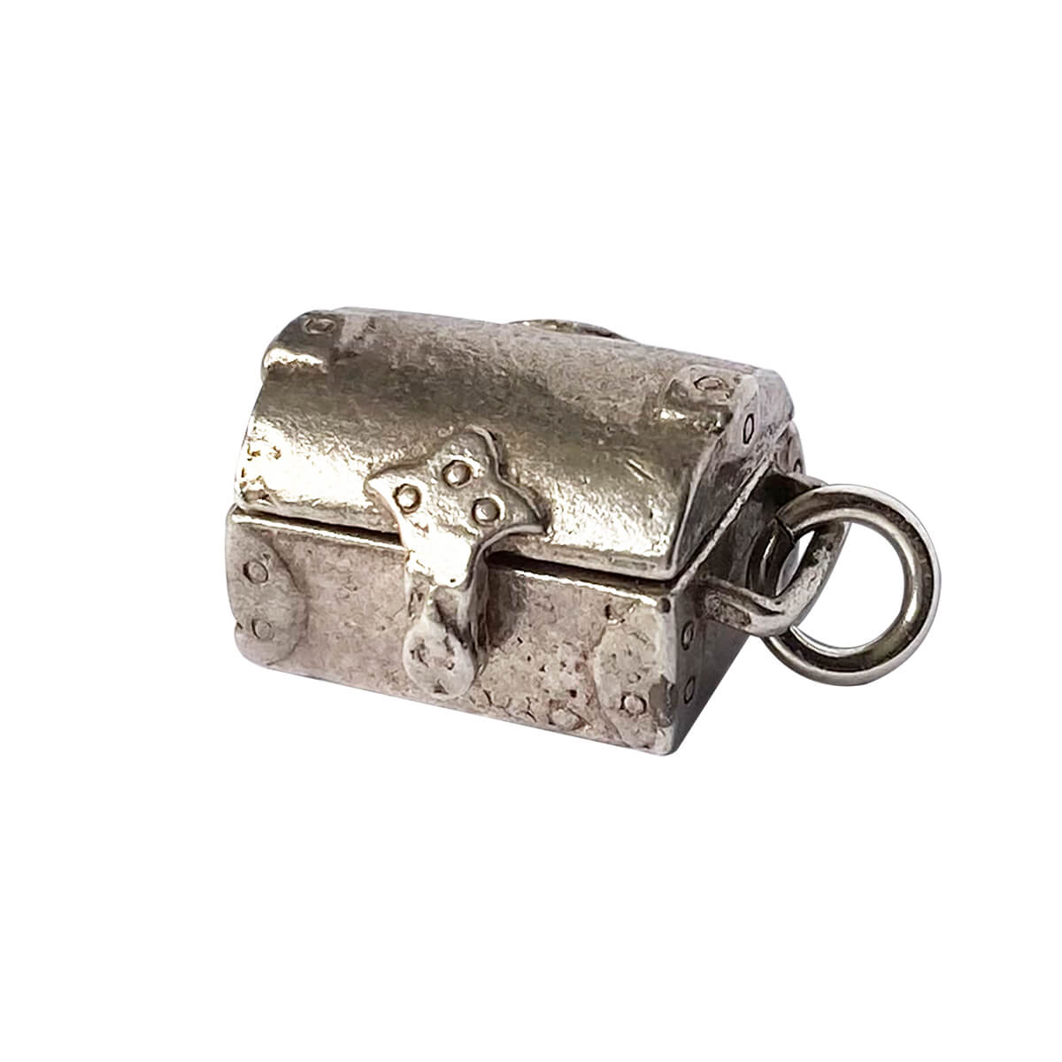 Vintage Nuvo sterling silver treasure chest charm opens to red crystal.