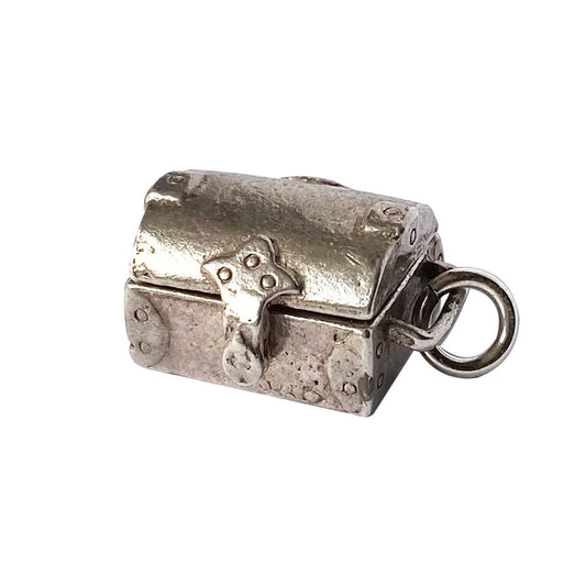 Vintage Nuvo sterling silver treasure chest charm opens to red crystal.