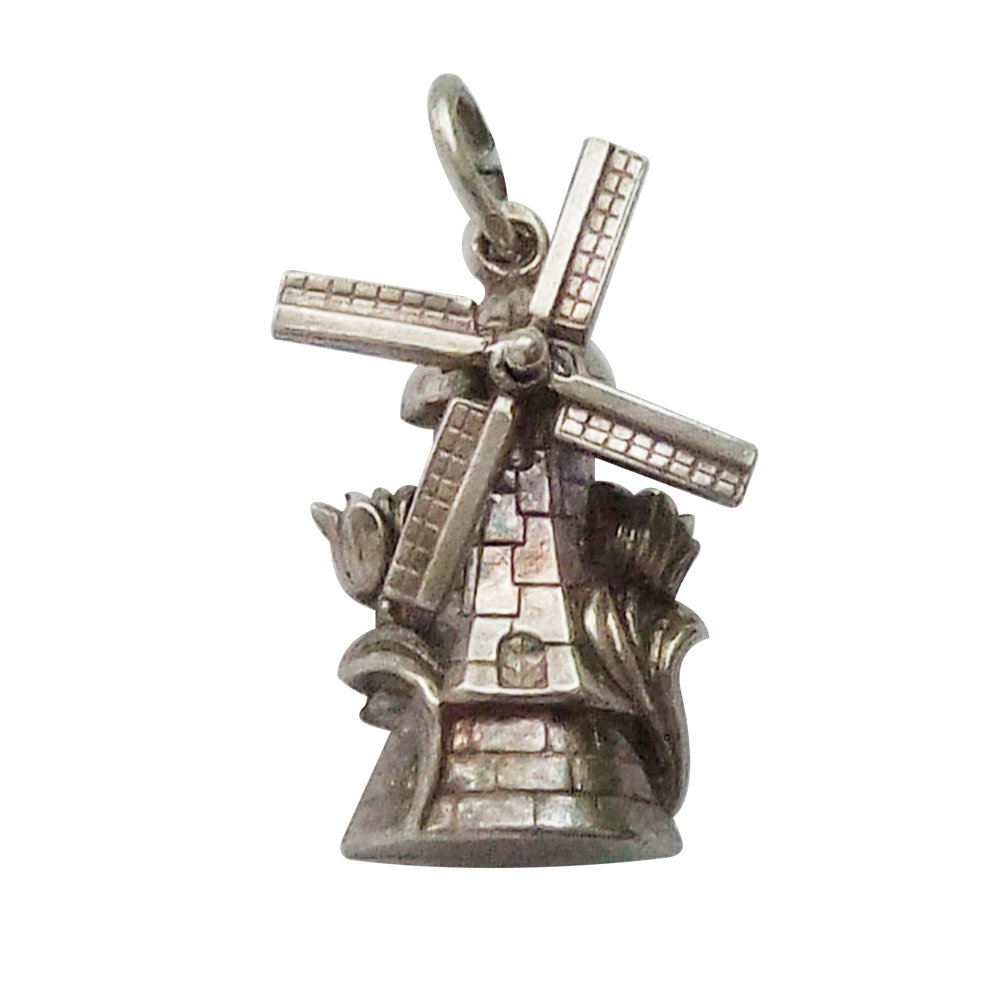 Vintage windmill charm with rotating sails and tulips
