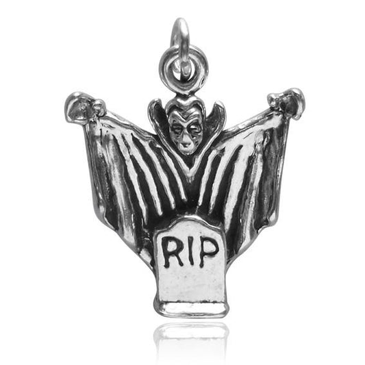 sterling silver dracula charm on white background