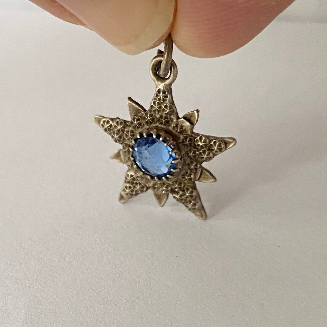 English silver antique star pendant with blue centre stone made in 1904 by Charles Horner