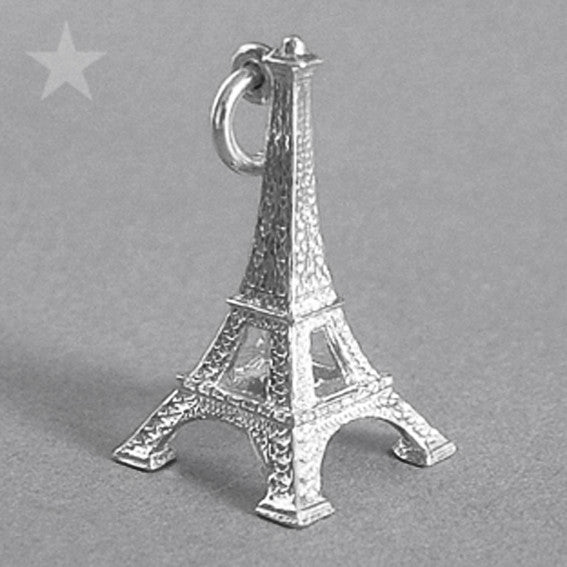 Sterling silver Eiffel Tower charm on a grey background