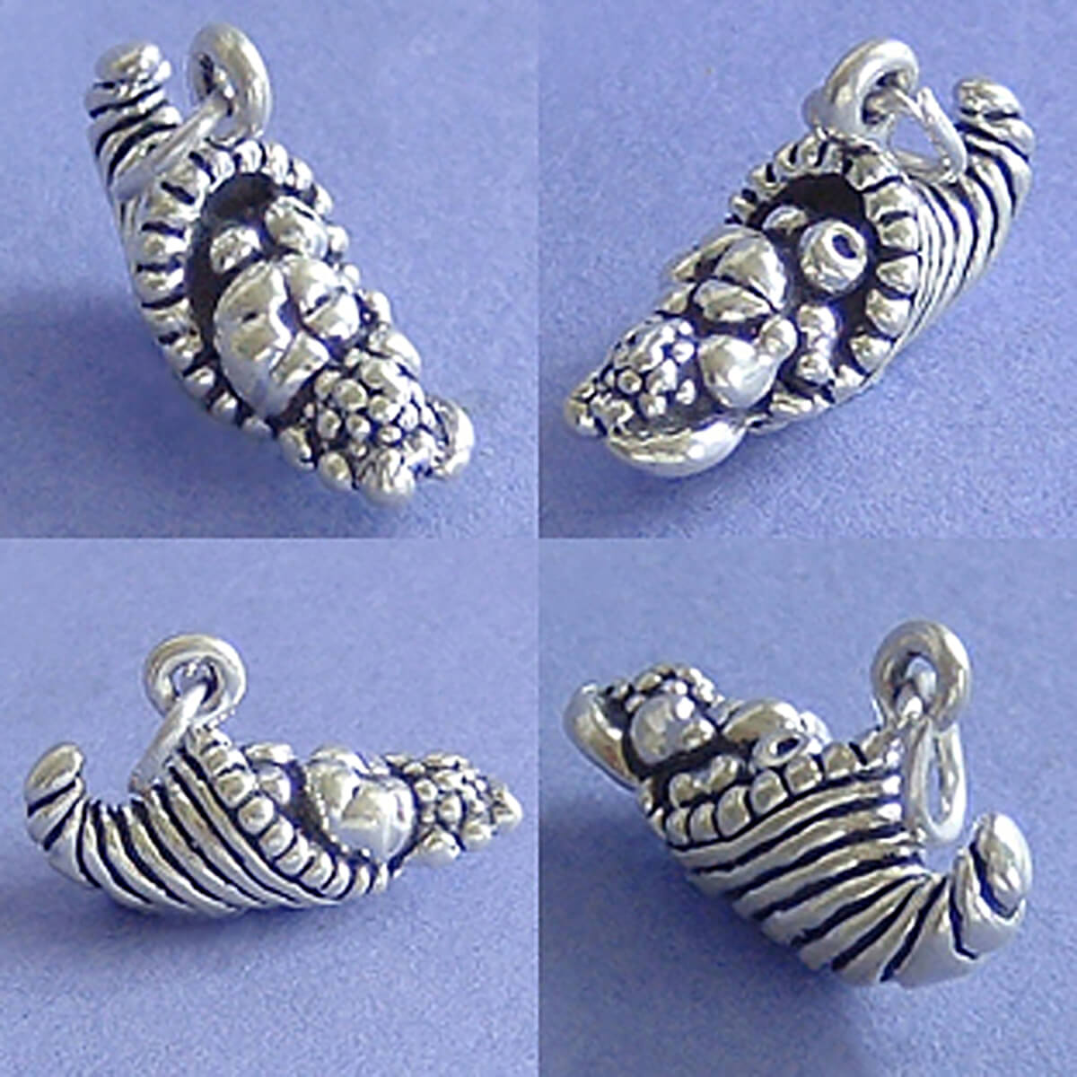 Sterling silver horn of plenty charm seen from four angles on a purple background