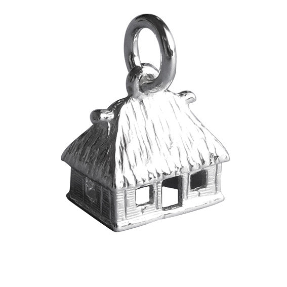Sterling silver Fijian house charm on a white background