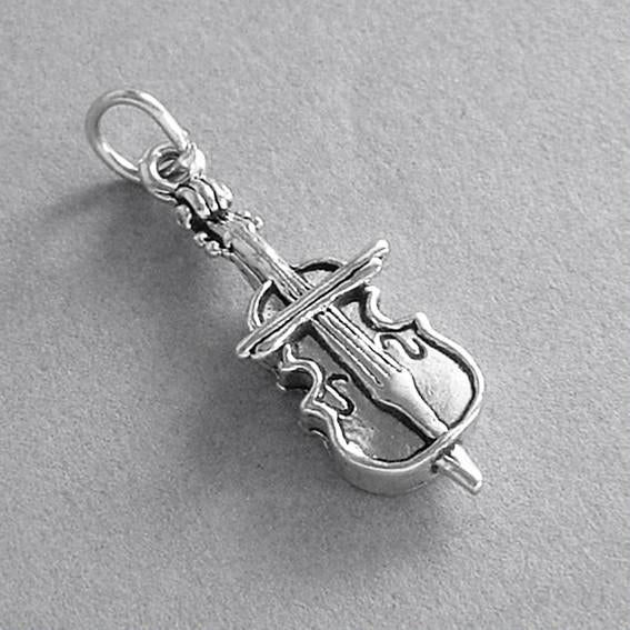 silver cello charm on a grey background