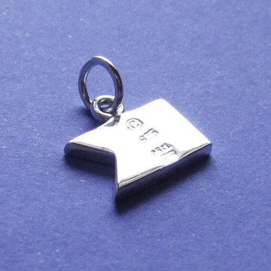 Sterling silver dive flag charm viewed from back with hallmarks on a white background