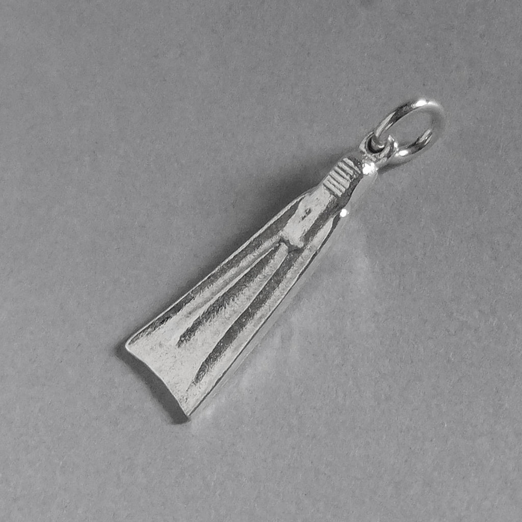 Sterling silver diving fin charm viewed from back on a grey background
