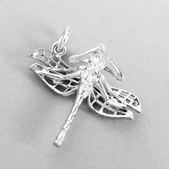 Sterling silver dragonfly charm, viewed from back, on a grey background