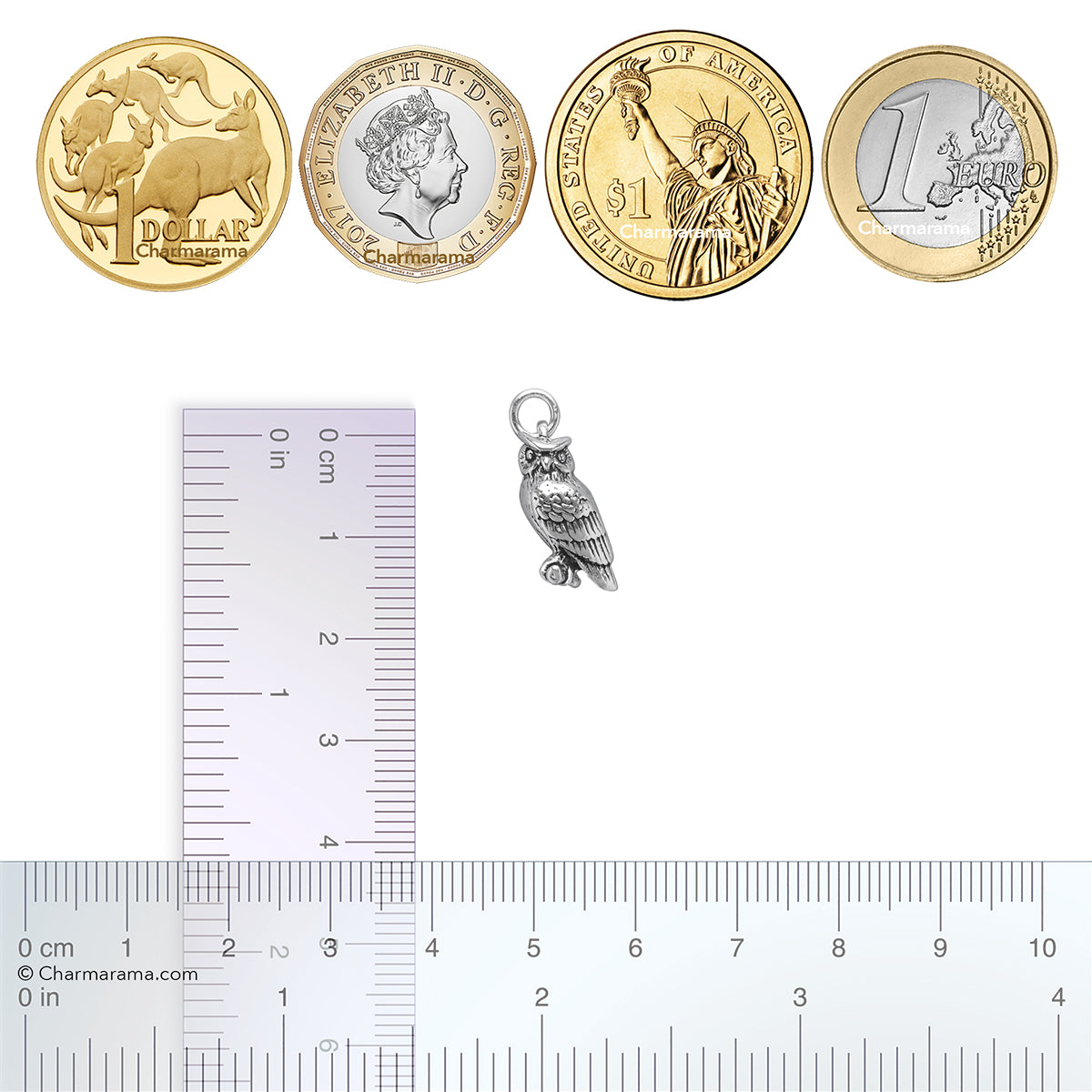 Sterling silver eagle owl charm with coins and ruler for scale on a white background