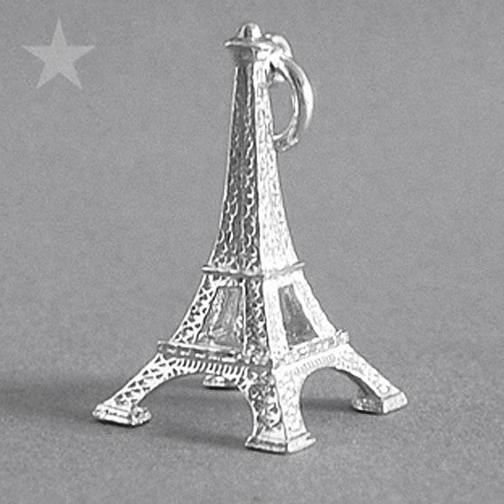 Sterling silver Eiffel Tower charm on a grey background