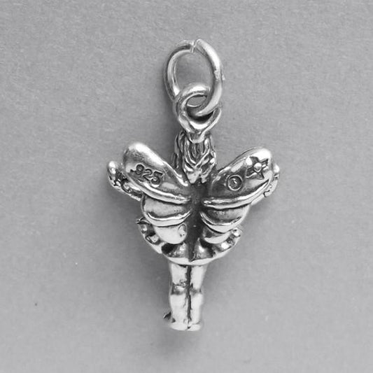 Back view of sterling silver fairy charm on a grey background
