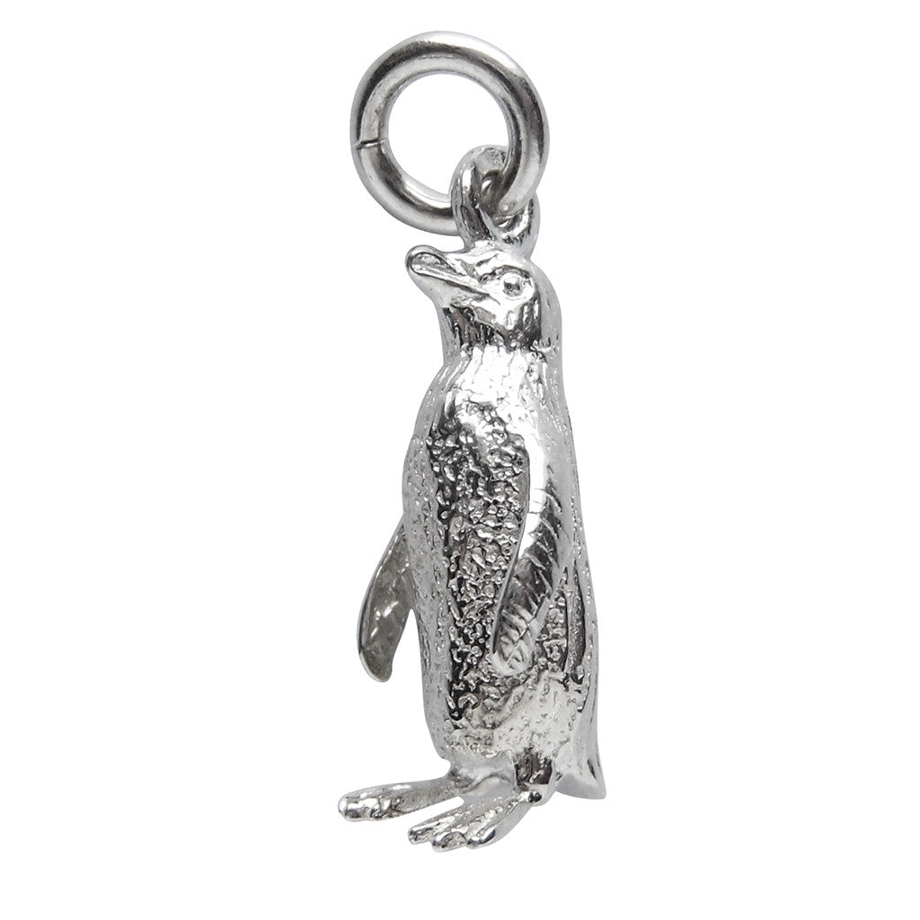 Sterling silver fairy penguin charm on a white background