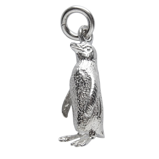 Sterling silver fairy penguin charm on a white background