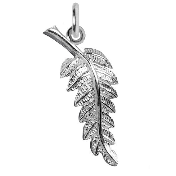 Sterling silver fern leaf charm on a white background