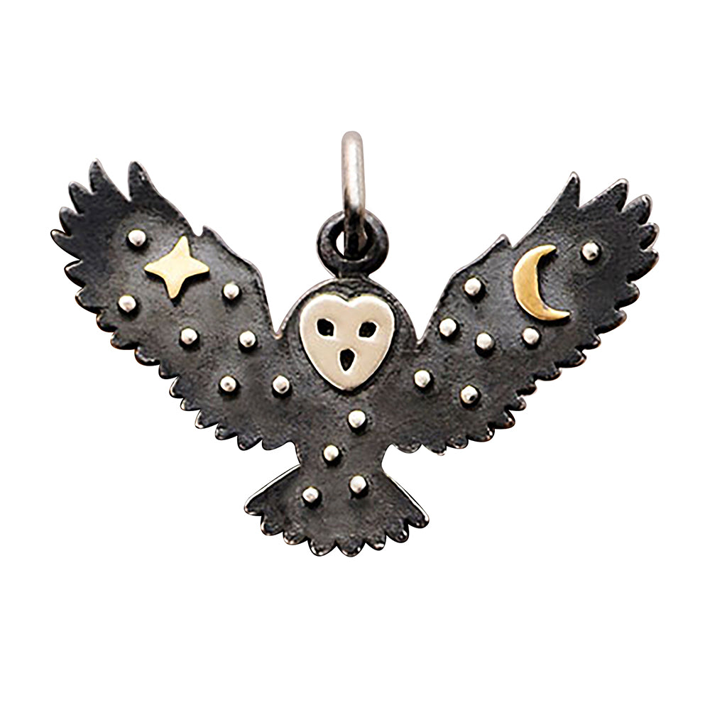 Sterling silver flying owl charm with bronze moon and star decoration on a white background