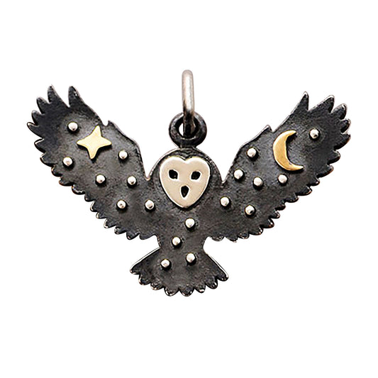 Sterling silver flying owl charm with bronze moon and star decoration on a white background