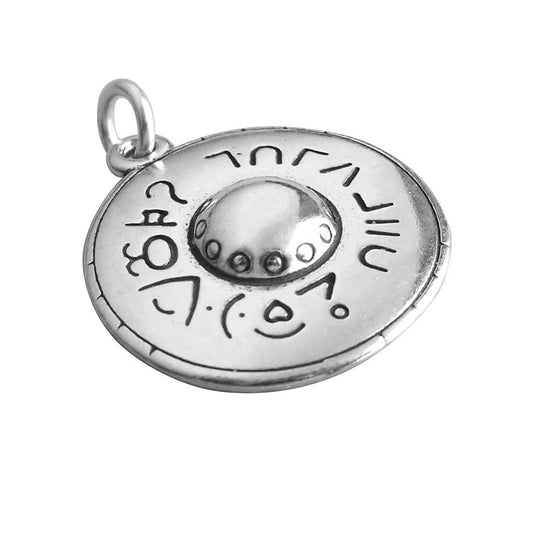 Sterling silver flying saucer charm on a white background