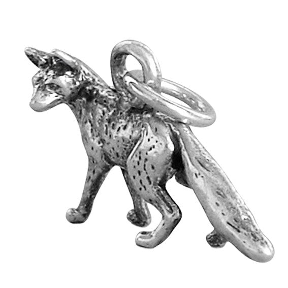 Sterling silver fox charm on a white background