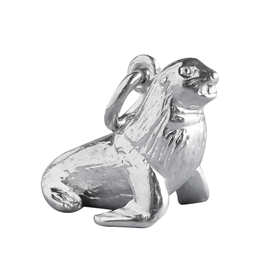 Sterling silver fur seal charm on a white background