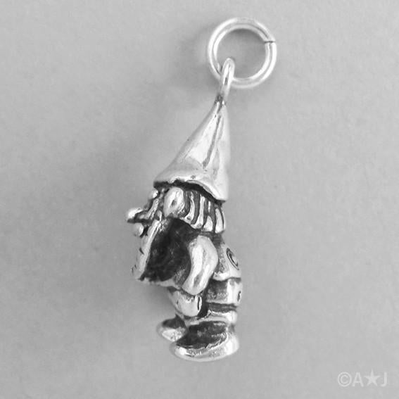 Side view of a sterling silver garden gnome charm on a grey background