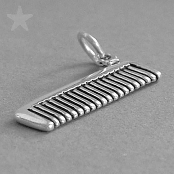 Sterling silver hair comb charm on a grey background