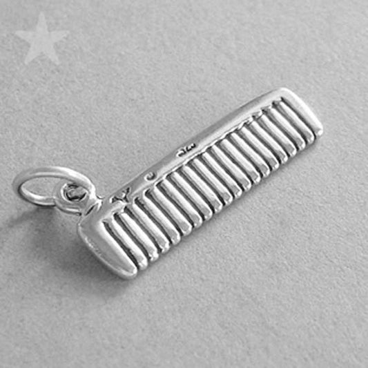 Sterling silver hair comb charm on a grey background