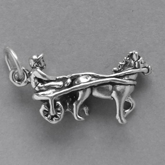 Sterling silver harness racer charm on a grey background
