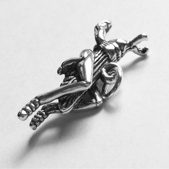 Sterling silver grasshopper charm on a grey background