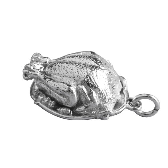 Sterling silver roast turkey charm on a white background