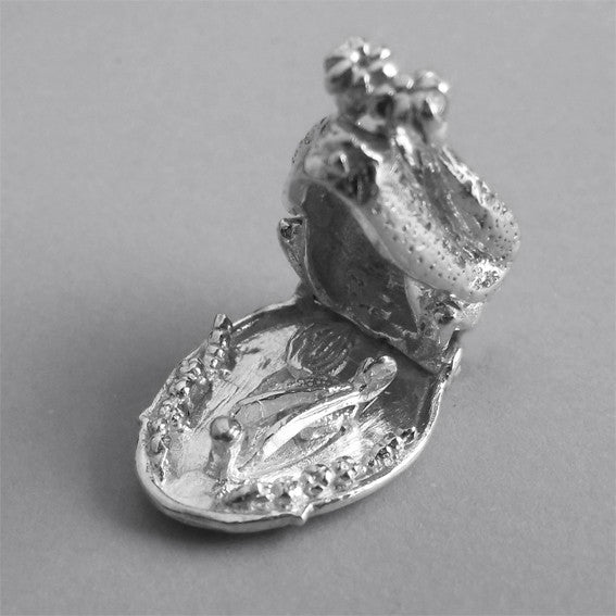 Sterling silver roast turkey charm in open position on a grey background