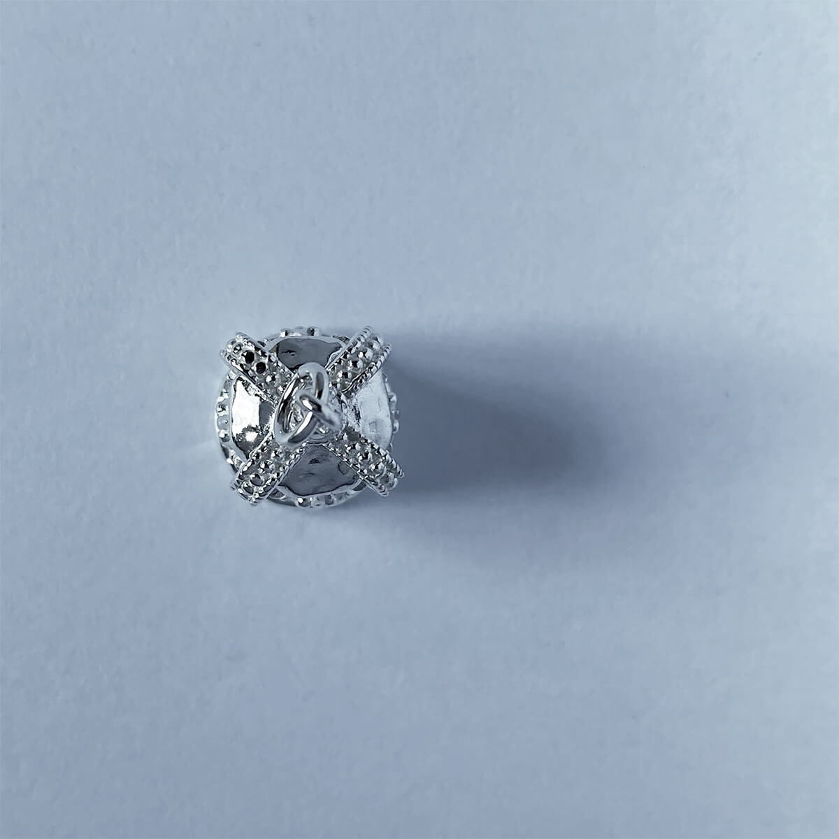 Sterling silver 3D St Edward's crown charm on a grey background