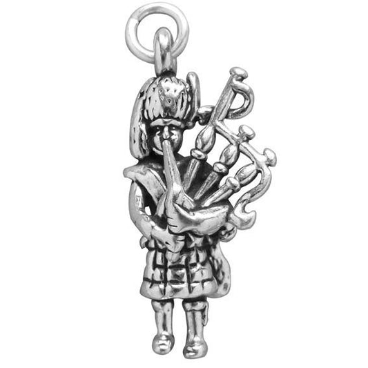 silver bagpiper charm on a white background