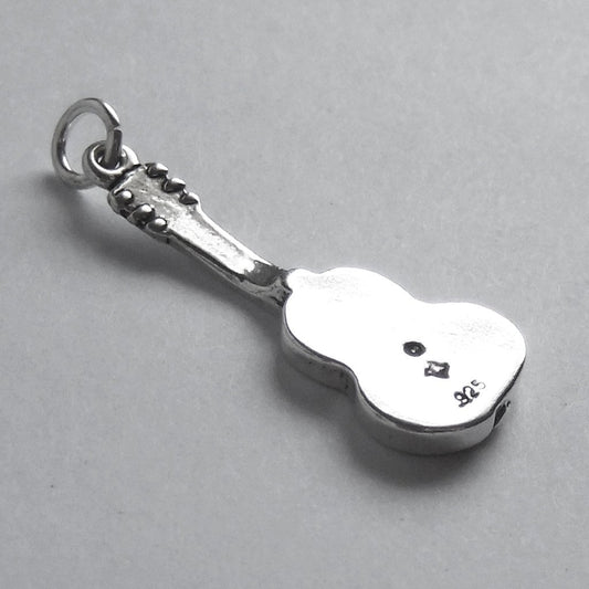 back view of a classic guitar charm on grey background