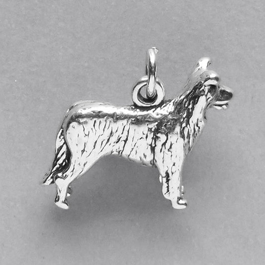 silver border collie dog charm on a grey background