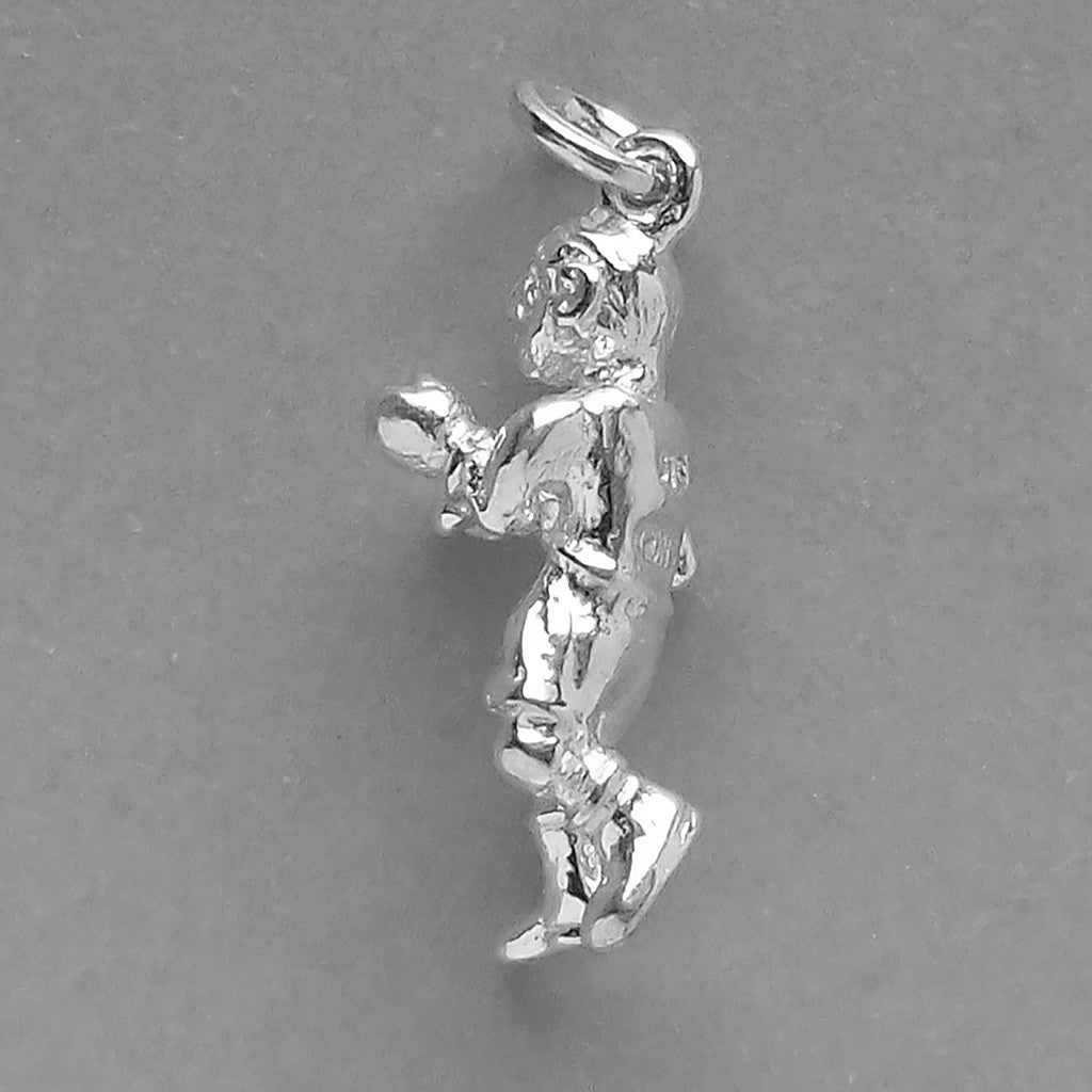 Man boxing charm in sterling silver on a grey background