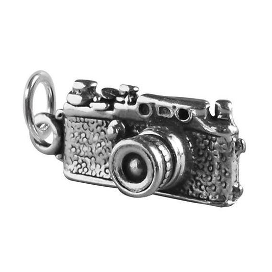 silver traditional camera charm on a white background