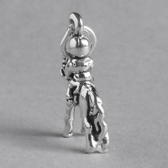 silver child on pony charm on grey background