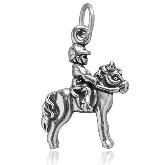 silver child on pony charm on white background