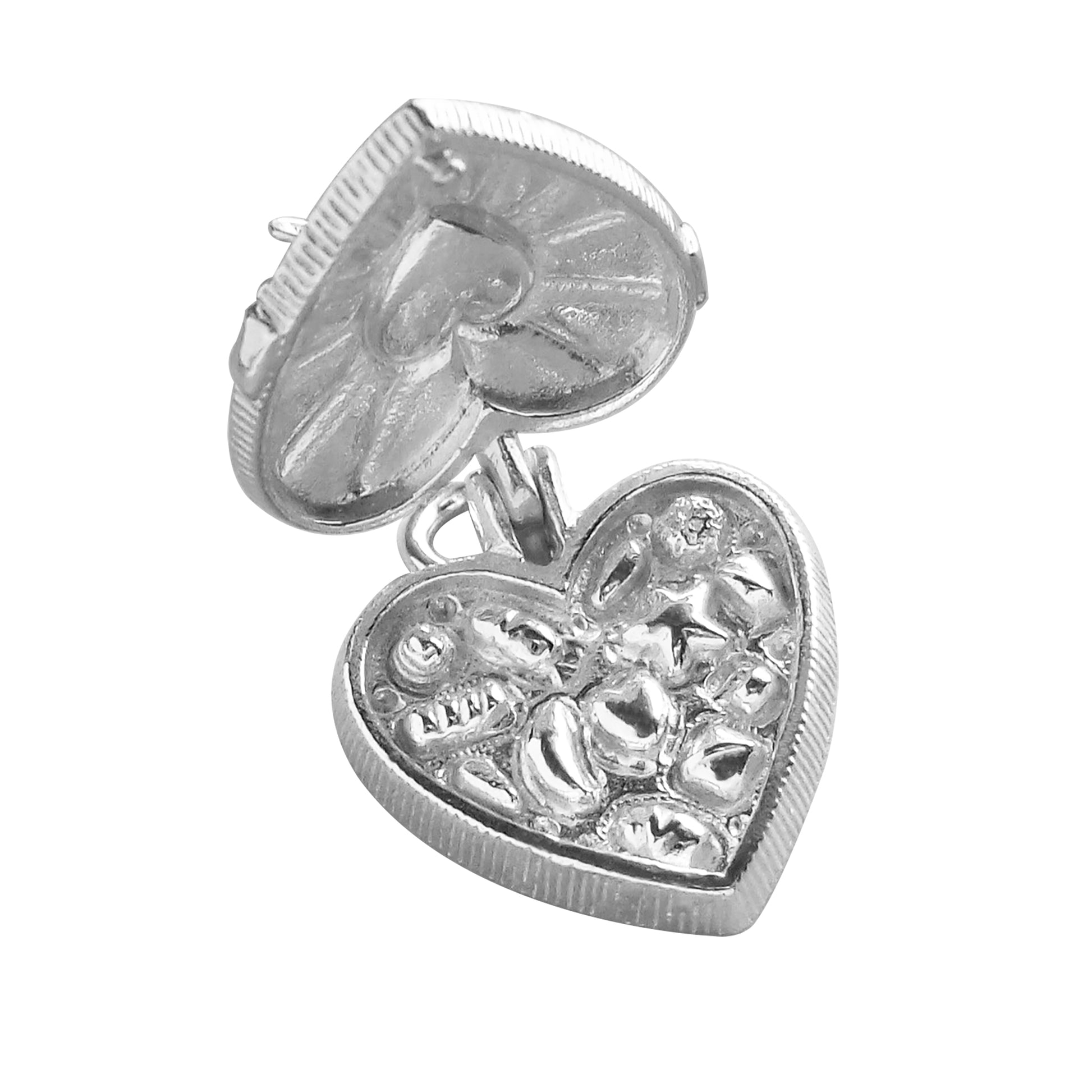 silver heart shaped chocolate box charm open revealing chocolates on a white background